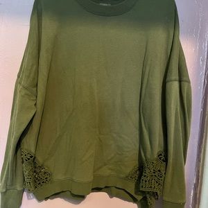 Green Aerie sweater, with crotchet on the sides of sweater.